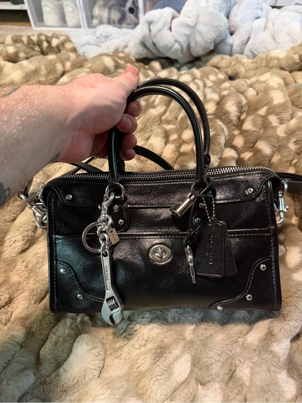 COACH - Rhyder 24 Black Leather with Wrench Bag Charm